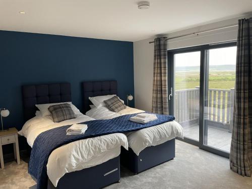 A bed or beds in a room at Machrie View