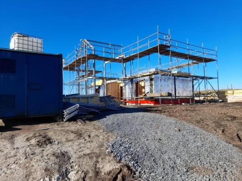 a building under construction with scaffolding on it at Machrie View in Port Ellen