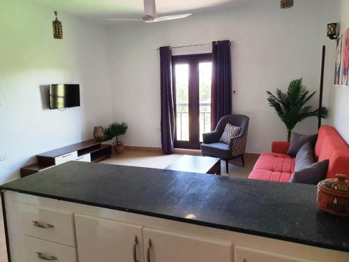 a living room with a couch and a table at CASA LOKO Guest House in Luxor