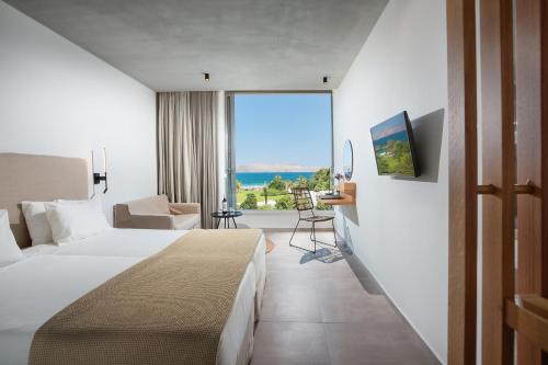 Postel nebo postele na pokoji v ubytování Caravia Beach Hotel