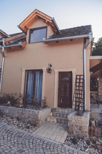 a house with a door and a brick driveway at Villa 1880 in Sremski Karlovci