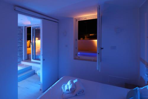 a room with a mirror and a room with a window at IL GELSO BIANCO Luxury apartments in Polignano a Mare