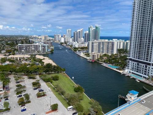 a view of a river in a city with tall buildings at Sunlit BeachWalk Studio 2 Full Beds Coastal Charm -26B in Hallandale Beach
