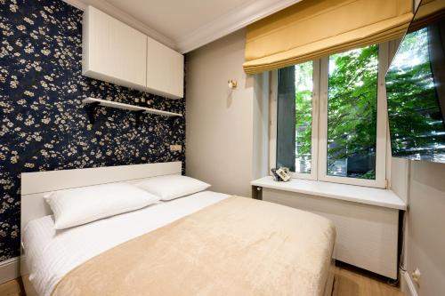 Posteľ alebo postele v izbe v ubytovaní Native Apartments Nowowiejska 9