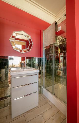 a bathroom with a sink and a shower at Vale House in Belvoir