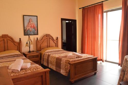 Cama o camas de una habitación en Gmiel in-Natura B&B
