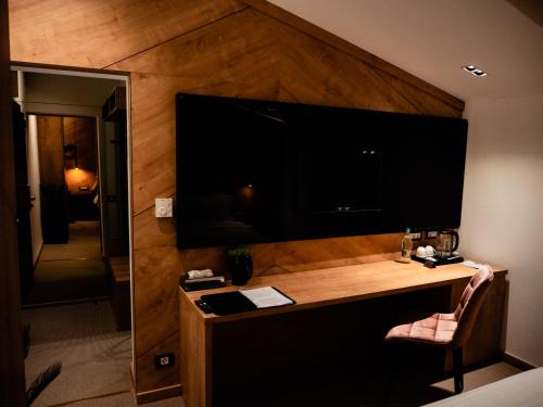 TV a/nebo společenská místnost v ubytování Hotel Goya Boutique