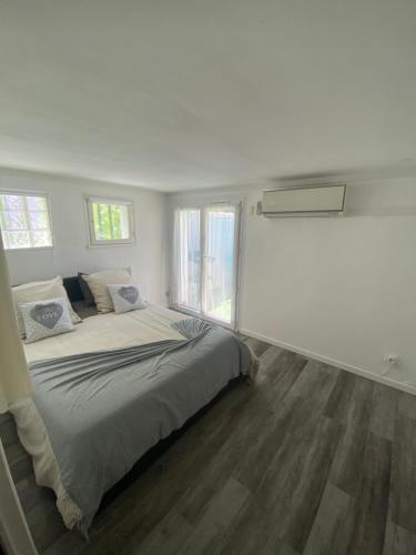 Katil atau katil-katil dalam bilik di Appartement cosy en résidence