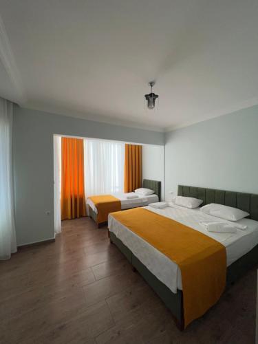 Кровать или кровати в номере Alanya Queen Apart Otel