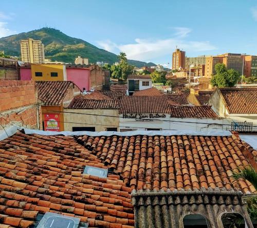 a view of a city with red tile roofs at Parrot House San Antonio in Cali