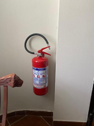 a fire extinguisher is hanging on the wall at Villa Franca in Reggio Calabria