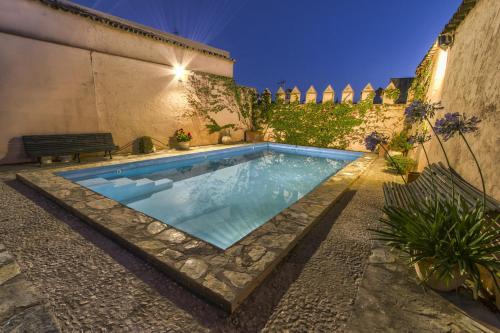 a swimming pool in the backyard of a house at Finca Villa Juan in Ribera del Fresno