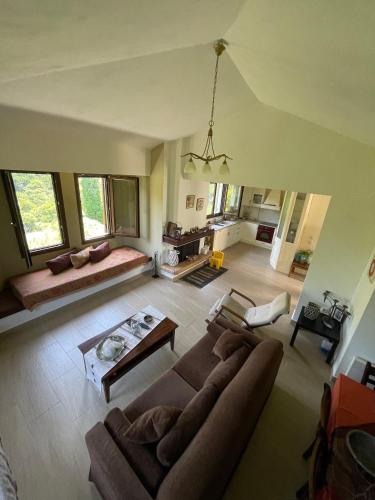 a large living room with a couch and a table at Casa verde ver in Makrirrákhi