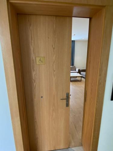 a door that is open to a living room at Hasanah suites in Al Madinah
