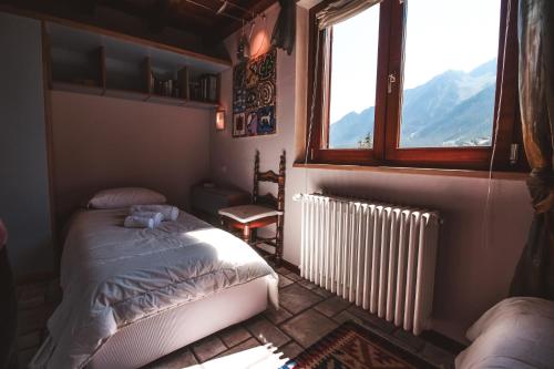 En eller flere senge i et værelse på Villetta Periax - Affitti Brevi Italia