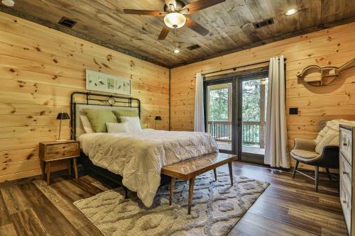 a bedroom with a bed and a ceiling fan at Highlands Retreat the Perfect Cabin for your relaxing experience in Mineral Bluff