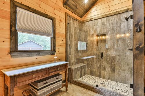 a log cabin bathroom with a shower and a window at Highlands Retreat the Perfect Cabin for your relaxing experience in Mineral Bluff