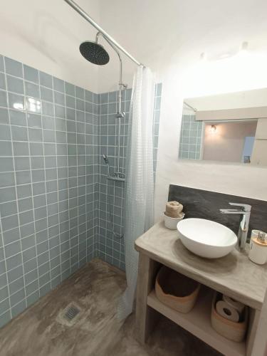a bathroom with a sink and a shower at Casa Torta in Outeiro