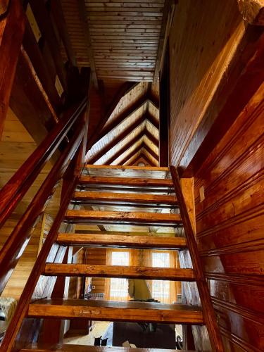 an overhead view of a wooden staircase in a cabin at Sky High Kolasin in Kolašin