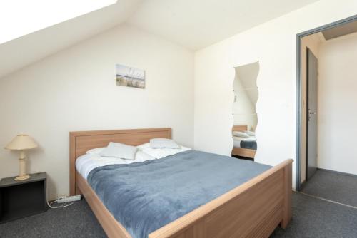 Postel nebo postele na pokoji v ubytování Le Regina Rifle - Appartement avec jardinet