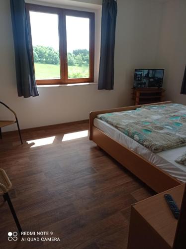 Postel nebo postele na pokoji v ubytování Apartmány u Bečova nad Teplou