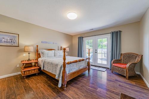 a bedroom with a bed and a chair at Balboa Rendezvous in McKinleyville