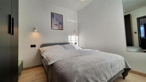 Ferrata Apartamenty Zakopaneにあるベッド