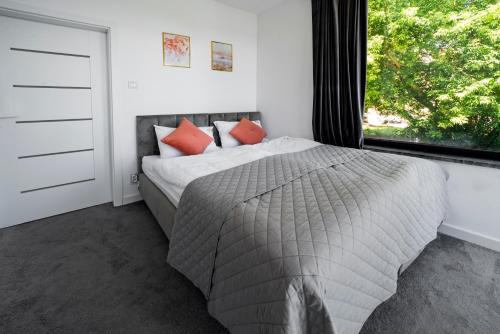 Postel nebo postele na pokoji v ubytování Apartamenty Z Widokiem Na Mazury Jezioro Czos Sauna Jacuzzi