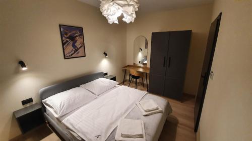 Ferrata Apartamenty Zakopaneにあるベッド