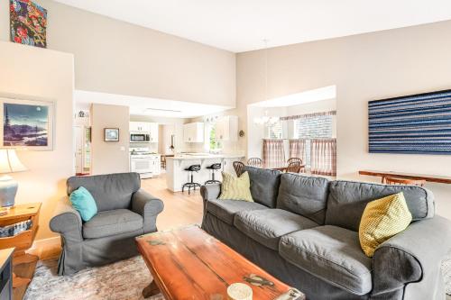 a living room with a couch and a table at Sunrise Serenity in Manzanita