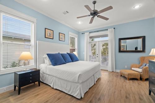 a bedroom with a bed and a ceiling fan at Aquanut Beach House 30A in Inlet Beach