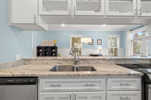 a kitchen with a sink and a counter top at Aquanut Beach House 30A in Inlet Beach
