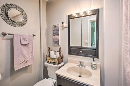 a bathroom with a sink and a toilet and a mirror at Pet-Friendly Somerset Cottage Near Boat Ramps! in Somerset