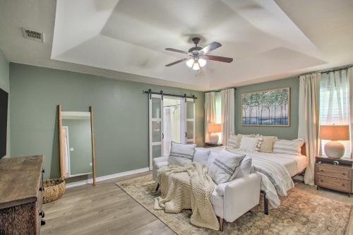 a bedroom with a bed and a ceiling fan at Cozy-Modern Pensacola Home Large Yard, Grill in Pensacola