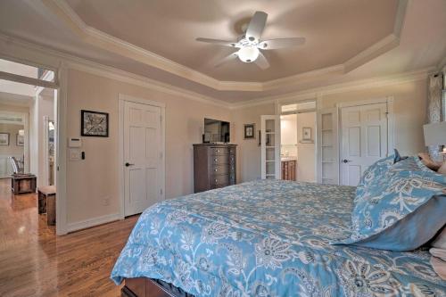 a bedroom with a bed and a ceiling fan at Beautiful Hiawassee Home with Mountain Views! in Hiawassee