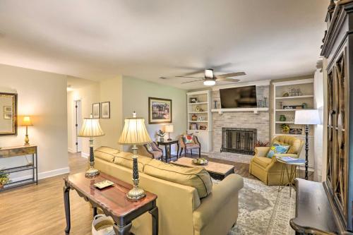 a living room with a couch and a fireplace at about 8 Mi to FSU Bright Tallahassee Retreat! in Tallahassee