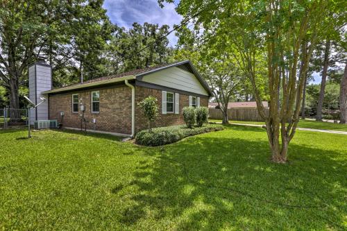 a brick house with a tree in the yard at about 8 Mi to FSU Bright Tallahassee Retreat! in Tallahassee