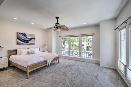 a bedroom with a bed and a ceiling fan at Oceanside Home with Rooftop Patio - Steps to Beach! in Oceanside