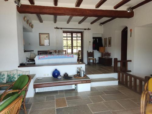 a living room with a couch and a table at Lito's dream villa by the sea! in Amaliápoli