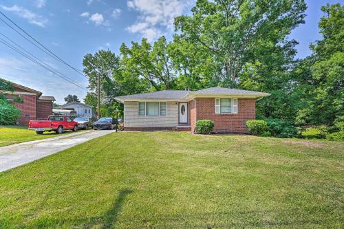 a small house with a lawn in front of it at Greensboro Home Less Than 4 Mi to Downtown! in Greensboro