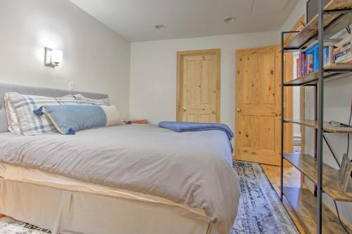 a bedroom with a bed and a book shelf at Modern Mountain-View Condo at Big Sky Resort! in Big Sky