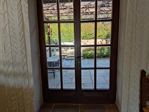 an open door with a view of a patio at Lito's dream villa by the sea! in Amaliápoli