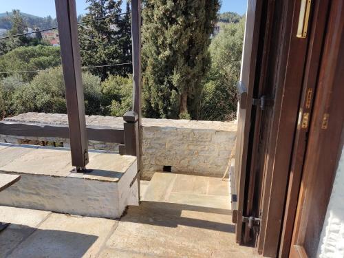 an open door to a room with a view at Lito's dream villa by the sea! in Amaliápoli