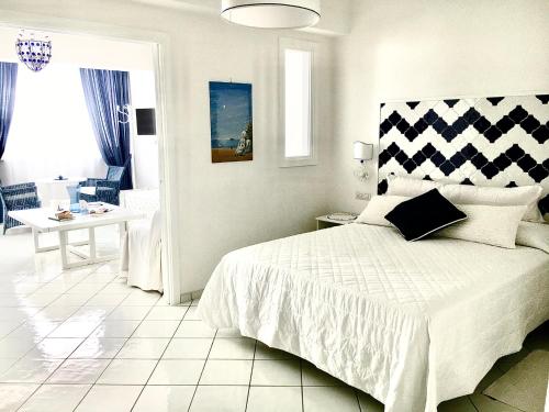 a bedroom with a bed and a living room at Marilù vacation home in Positano in Positano