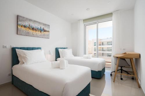 Postel nebo postele na pokoji v ubytování The hummingbird - Deluxe Apartment