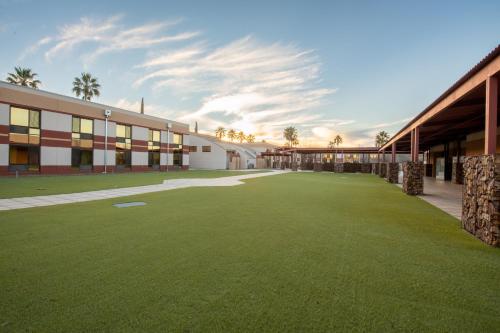 a large lawn in front of a building at Apache Gold Resort Hotel & Casino in Globe