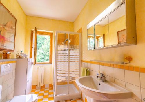 a bathroom with a sink and a shower and a toilet at The Ortensia, our Room with Lake View, Spacious Park-Facing Balcony and Private External Bathroom at the Villa Isabella Stresa in Stresa