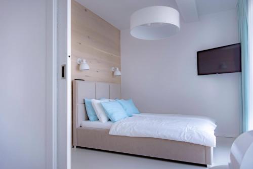 Postel nebo postele na pokoji v ubytování Promenada Gwiazd B72