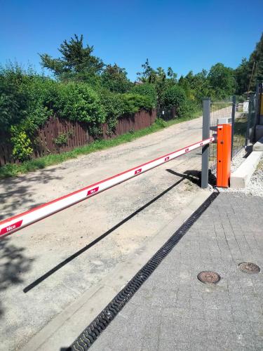 an orange and white barrier on the side of a road at Apartament Karpacz 2- pokojowy in Karpacz