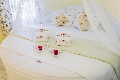 Ένα ή περισσότερα κρεβάτια σε δωμάτιο στο Dream Boutique Apartments